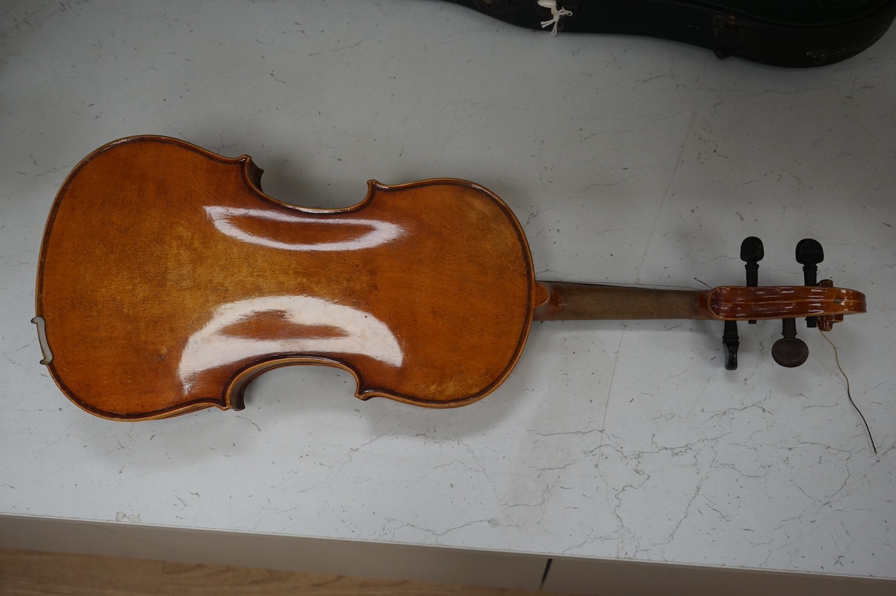 A cased full length violin, circa 1900 with bow, bears Stradivarius label to the interior. CITES Submission reference WVME8714